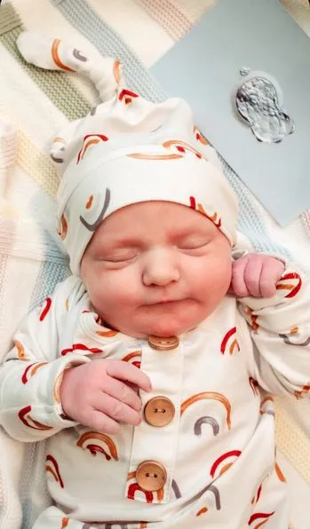 kim baby with rainbow hat